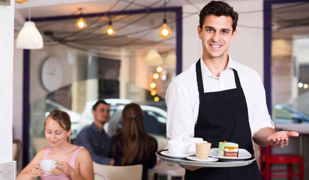 banquet server assisting guests